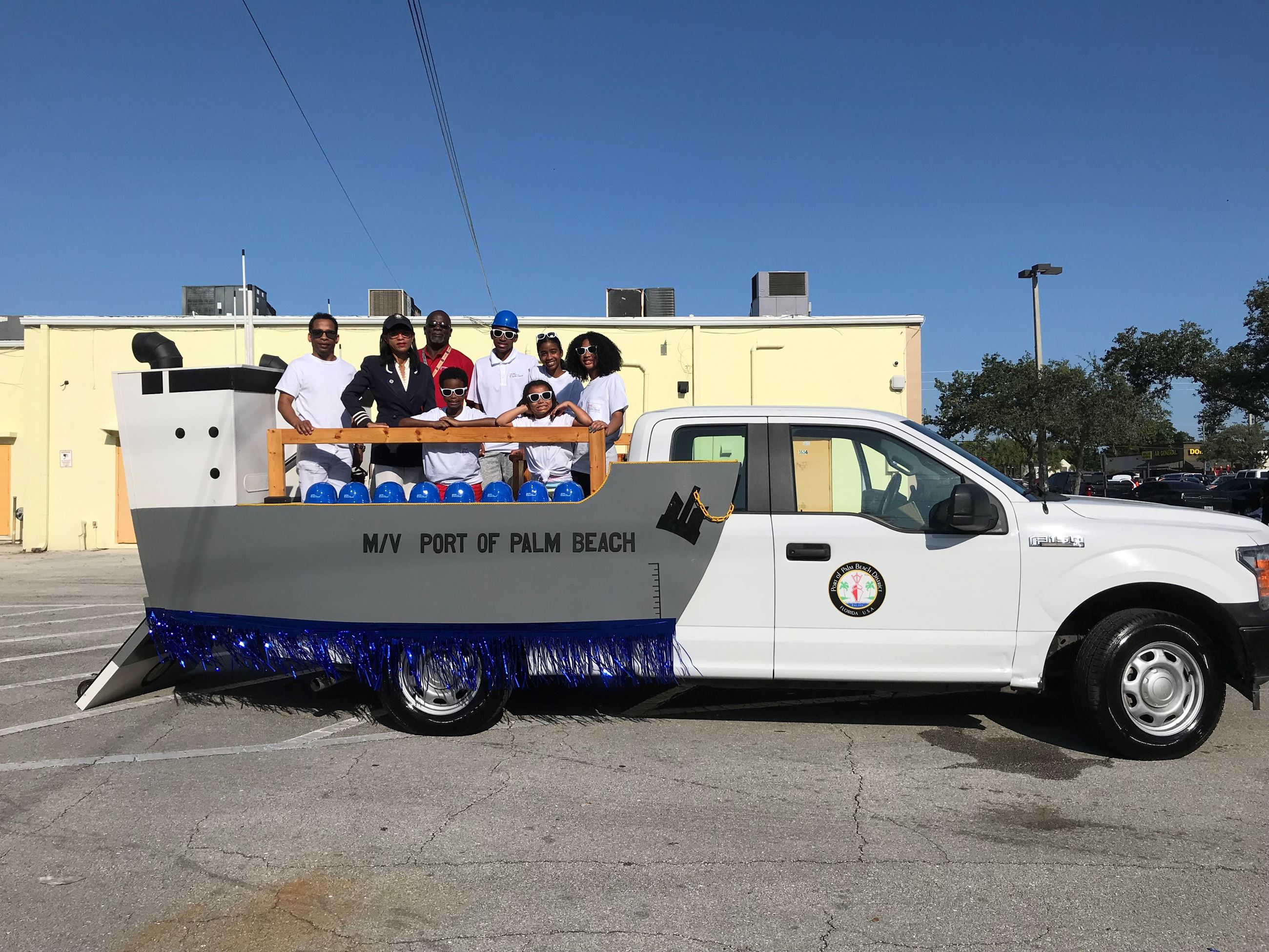 Port Commissioner Dr. Jean Enright, Director of Finance Michael Williams and Williams' kids