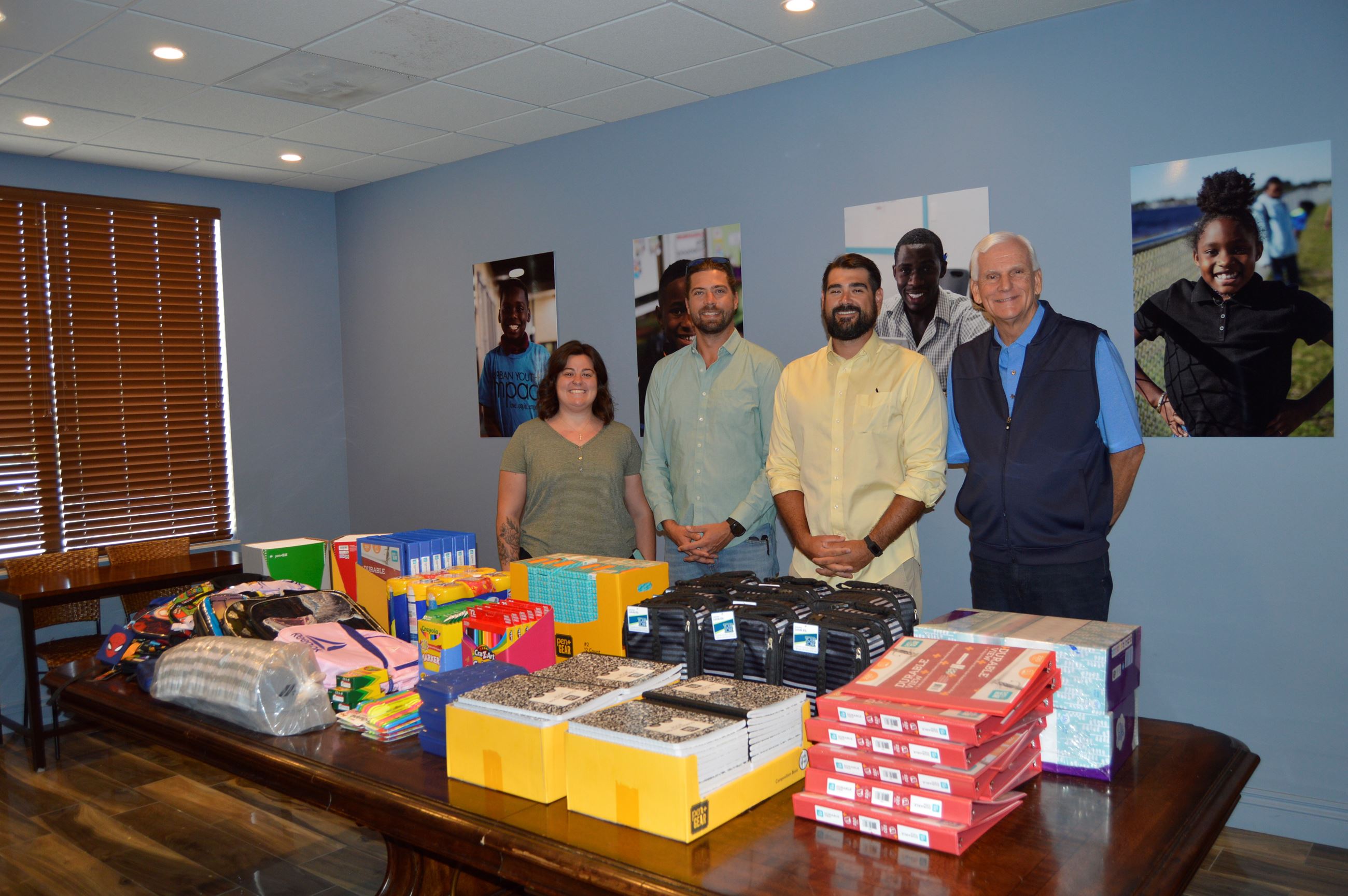 Matt Horne and Alexander Christensen donating school supplies