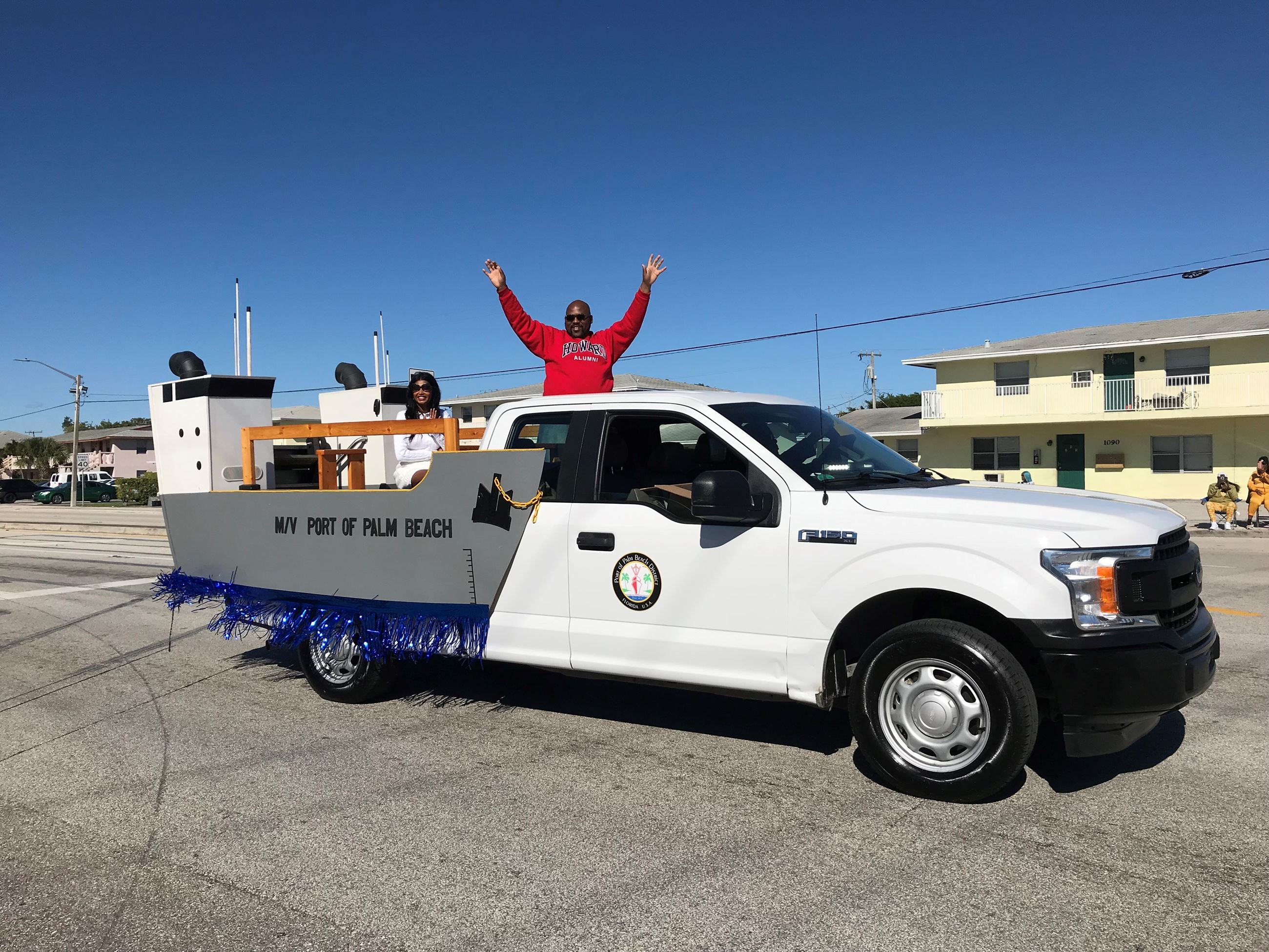 Port Commissioners Dr. Deandre Poole and Varisa Lall Dass on MLK parade float
