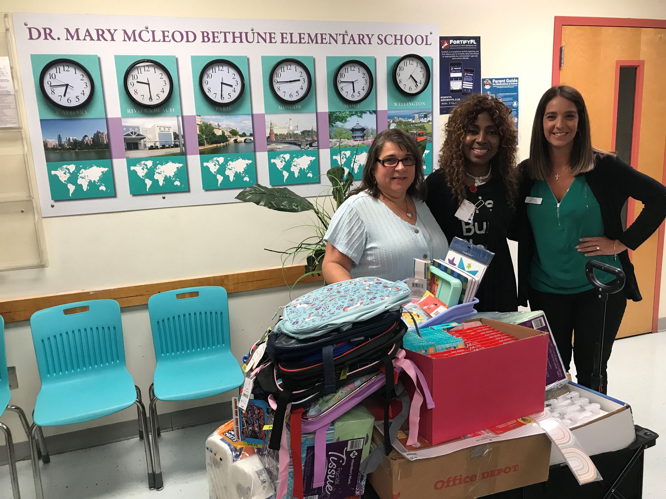 VP of Heavy Lift Tina Dias and PIO Yaremi Farinas with Dr. Mary McLeod Principal Granger